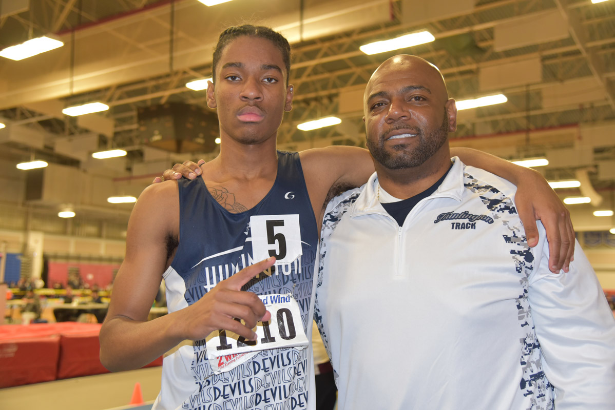 Huntington junior Jonathan Smith with Blue Devil track head coach Ronald Wilson. 
