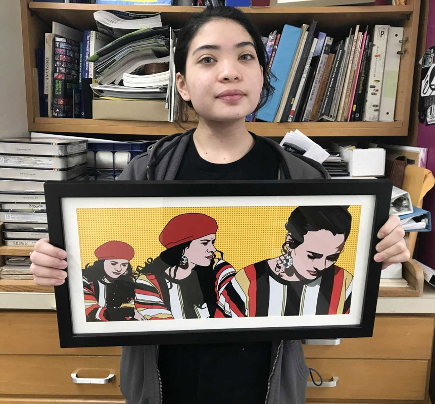 Huntington sophomore Mia D'Alessandro holds her framed artwork.