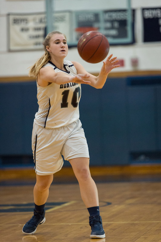 Huntington senior Katie Seccafifo dishes off the ball. (Darin Reed photo.)