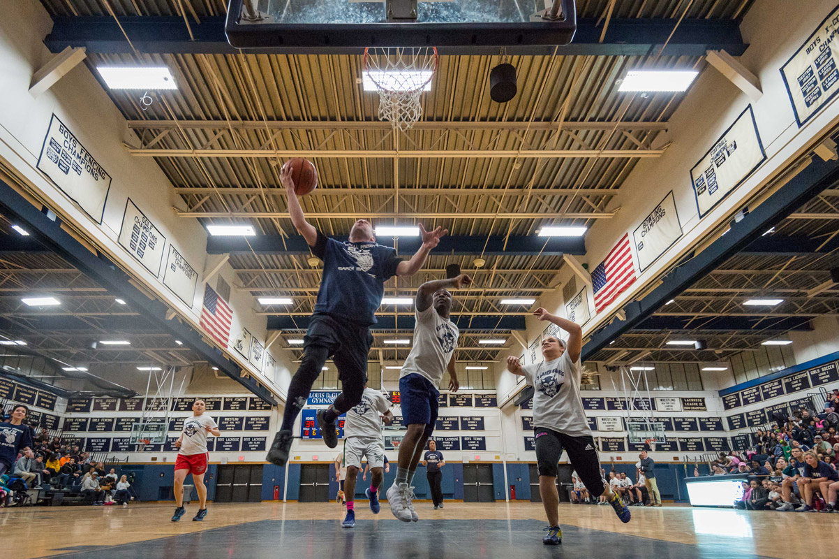 Woodhull teacher Jason Suarez goes to the basket. (Darin Reed photo.)