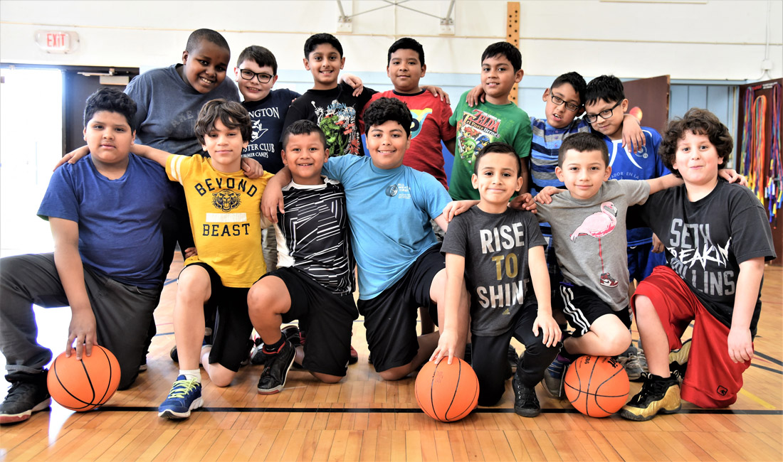 These fourth graders at Washington Primary School enjoy playing basketball in the gymnasium.