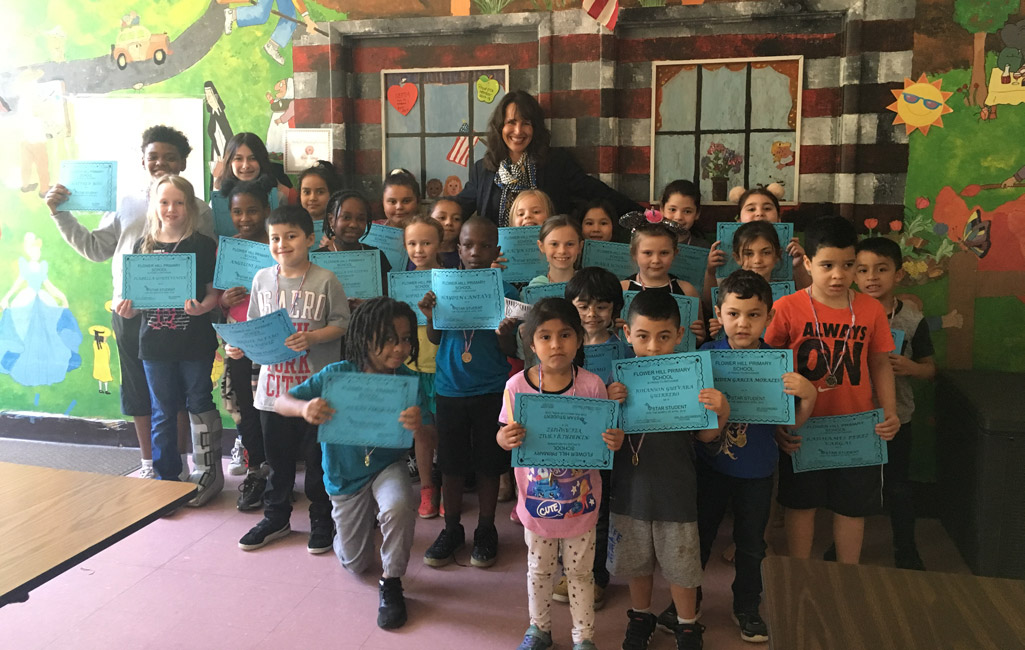 Flower Hill Principal Lucia Laguarda with April's Star Student Award recipients.