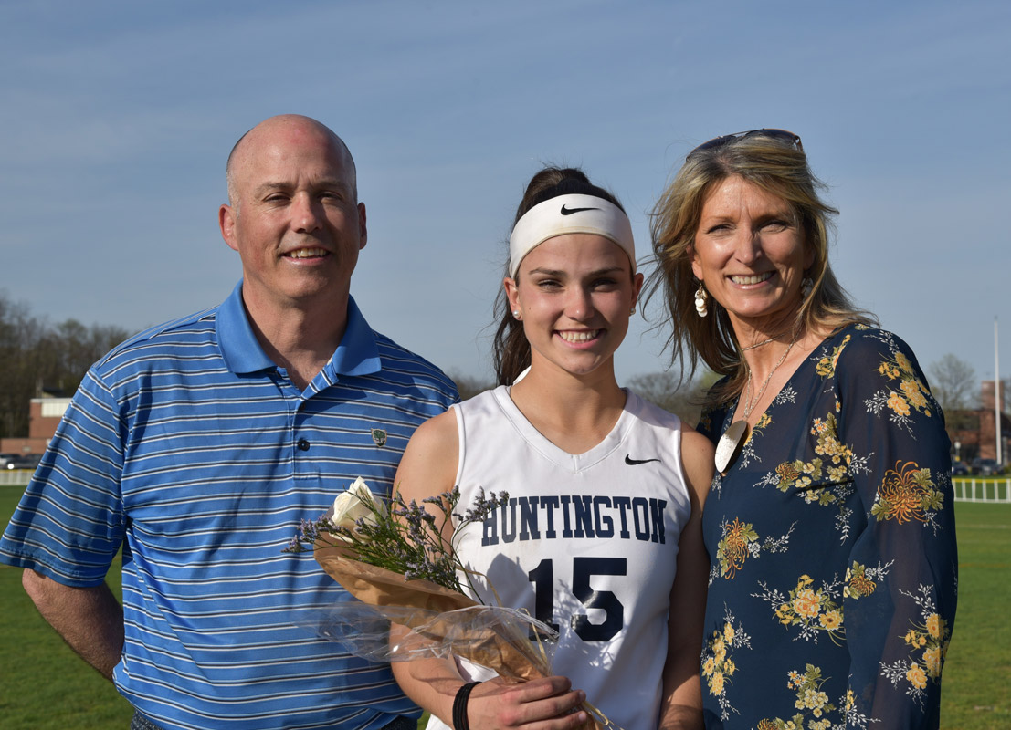 Amber Stieve with her parents, Paul and Denise on Senior Day at Blue Devil Field..