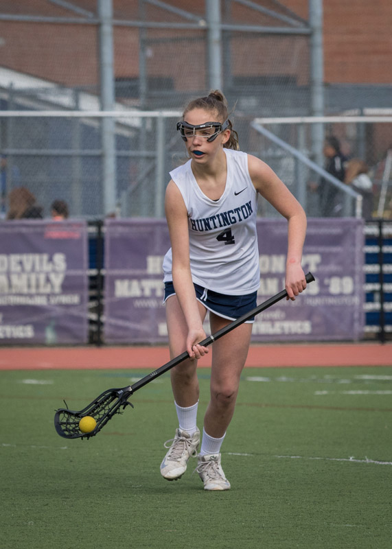 Katie Browne scoops up the ball for Huntington. (Mike Connell photo.)
