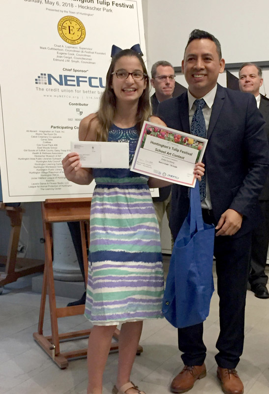 Emily Gersuny with Franco Ortiz,   NEFCU branch manager..