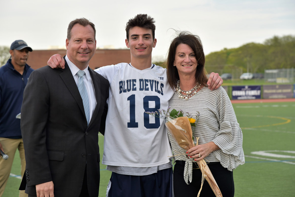 Alex LaBella with his parents, CJ and Julie on boys' lax Senior Day at Blue Devil Stadium