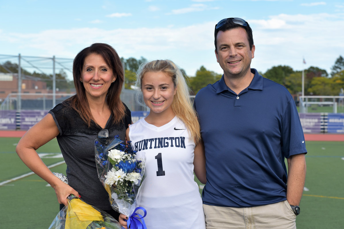 Huntington senior Lindsay McKenna with her parents, Donna and Michael on field hockey Senior Day at Blue Devil Stadium.
