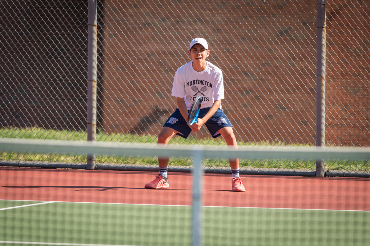 Sophomore Jack Flores in action for the Huntington tennis team. (Darin Reed photo (3)