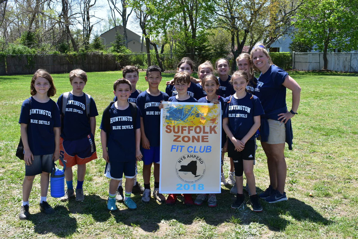 Teacher Carrie Postel with Woodhull School's Fit Club team