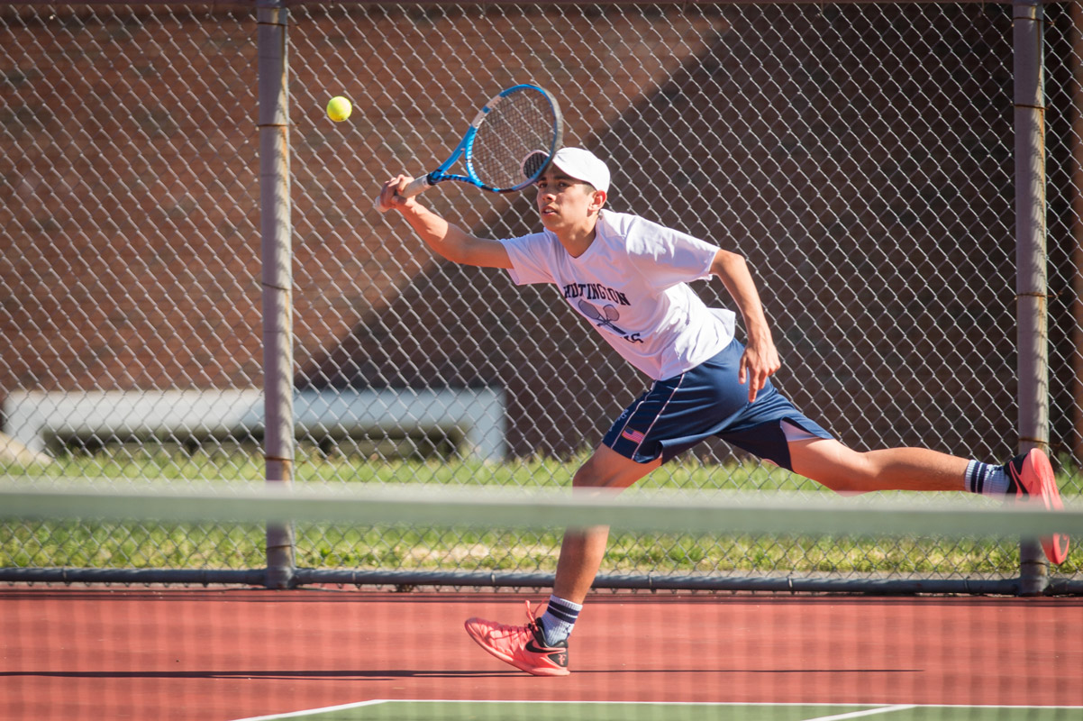 Sophomore Jack Flores in action for the Huntington tennis team. (Darin Reed photo