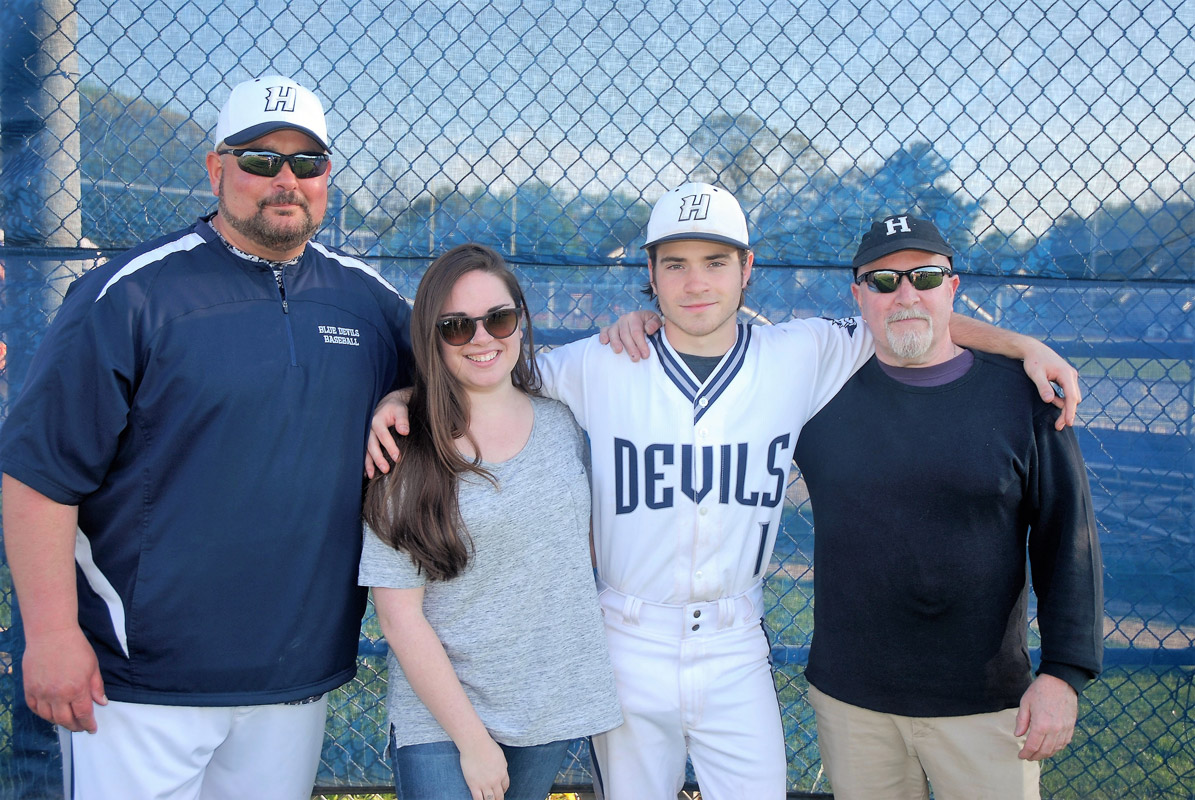 Ethan Copp with family members and head coach Billy Harris on Senior Day. (Monica Fredericks photo.)