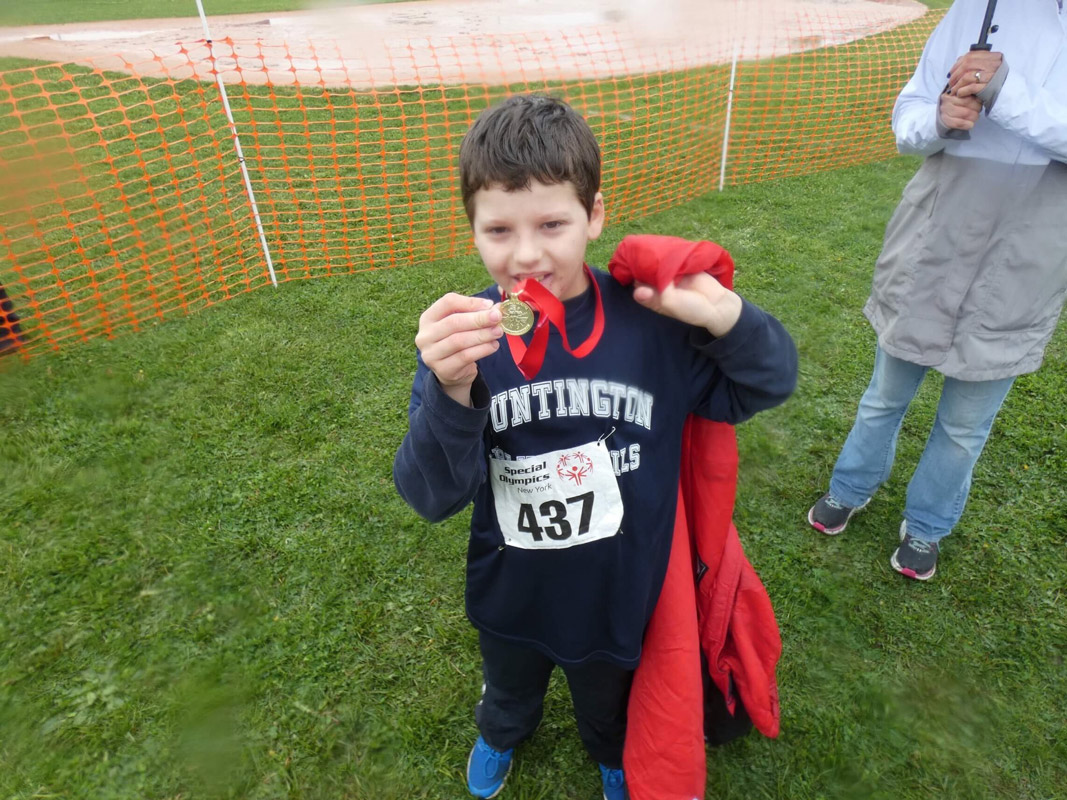 Huntington team members proudly showed off their medals