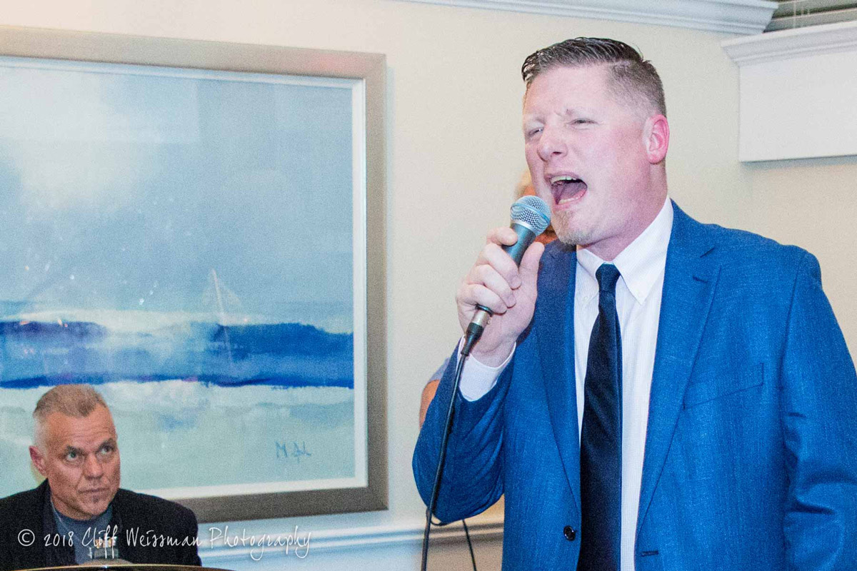 Huntington High School Principal Brenden Cusask sang at the gala. (Cliff Weissman photo.)