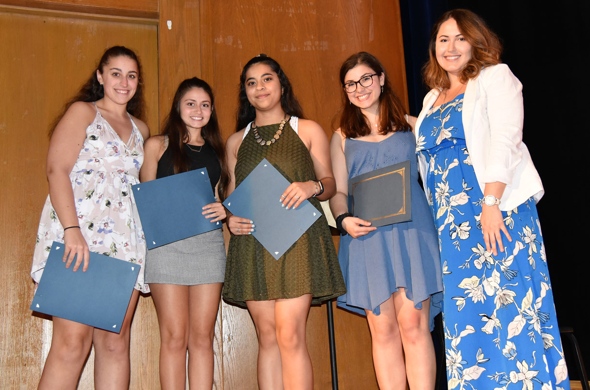 Jamie Spector, Casey Moskowitz, Katherine Aparicio and Bella McGinniss with Italian Honor Society advisor Natalia Kopshti.