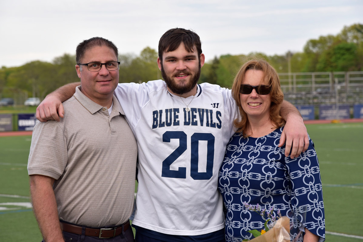 Chris Martin with his parents, Kevin and Karen on boys' lacrosse Senior Day at Blue Devil Stadium.