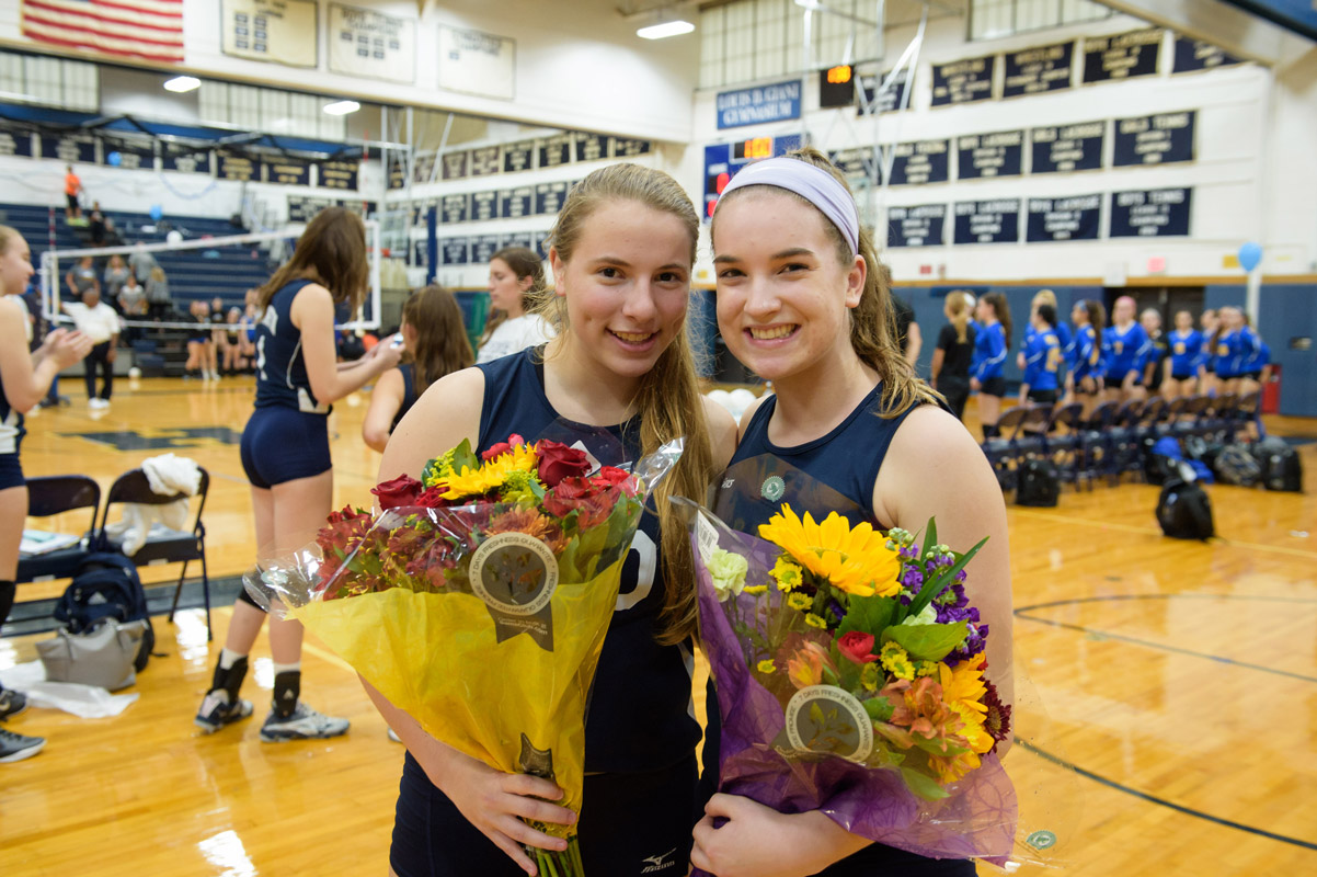 Lindsay Saginaw and Julia Rogan on girls' volleyball Senior Day last fall. (Darin Reed photo.)