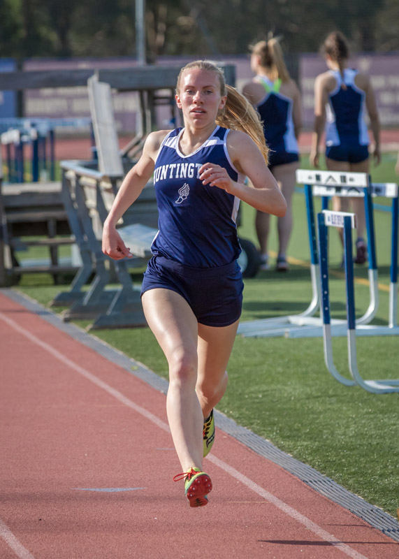 Senior Nicole Abbondandelo sprints to the finish line. (Mike Connell photo.)