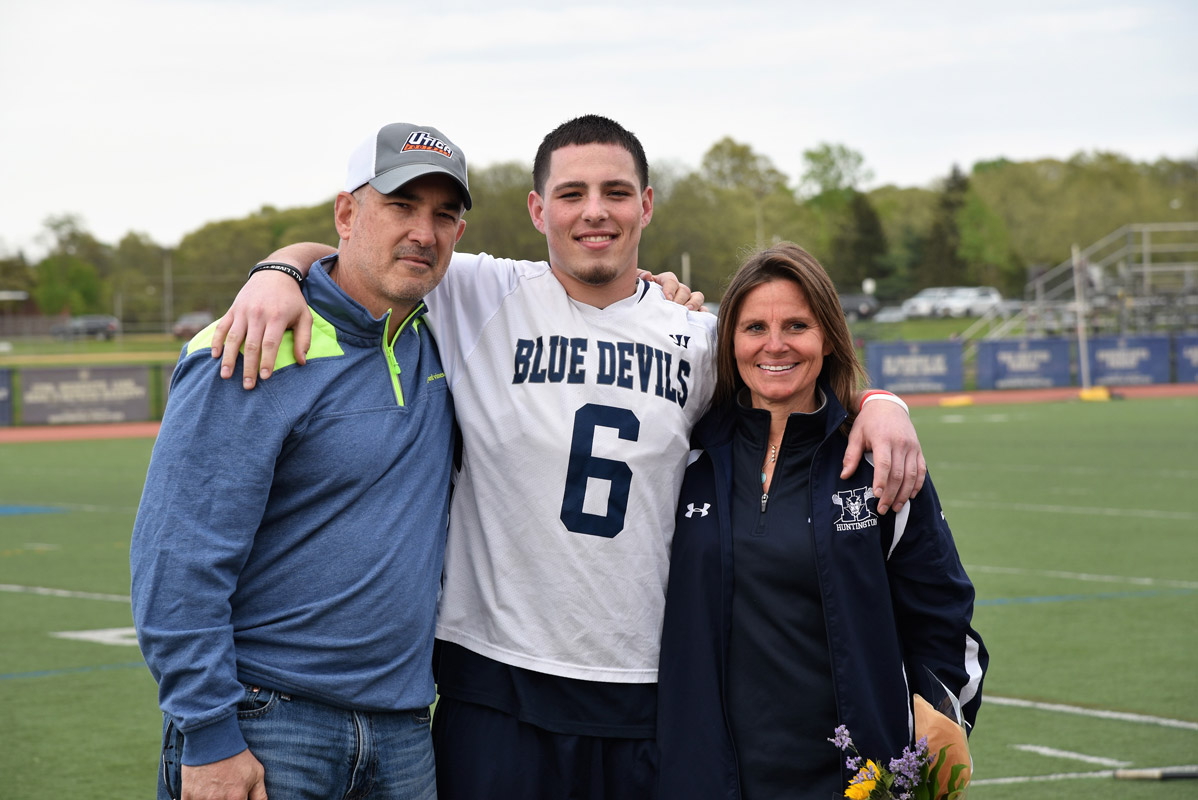 Anthony McDonald with his parents, Brian and Krista on Senior Day at Blue Devil Stadium.