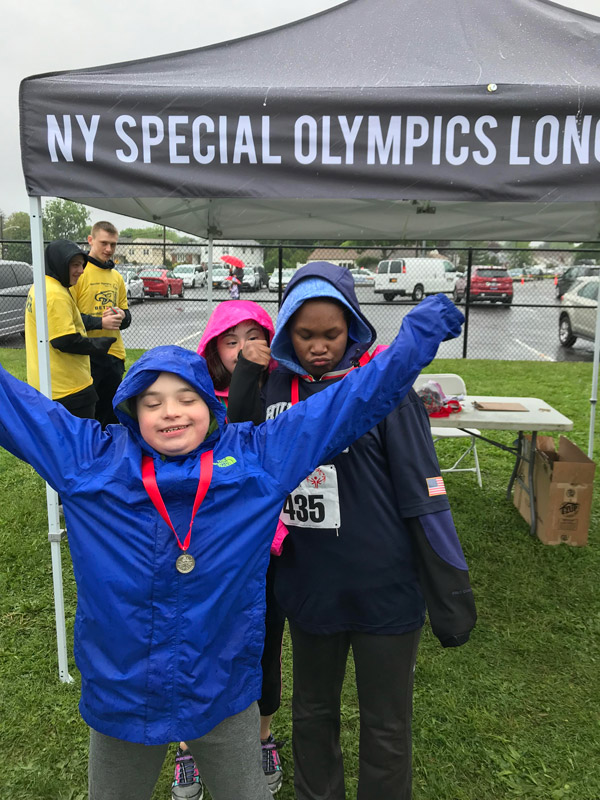 Huntington team members proudly showed off their medals
