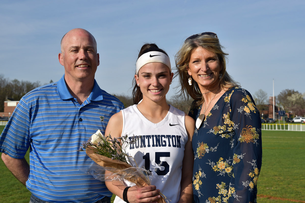 Amber Stieve with her parents, Paul and Denise on Senior Day at Blue Devil Field. 