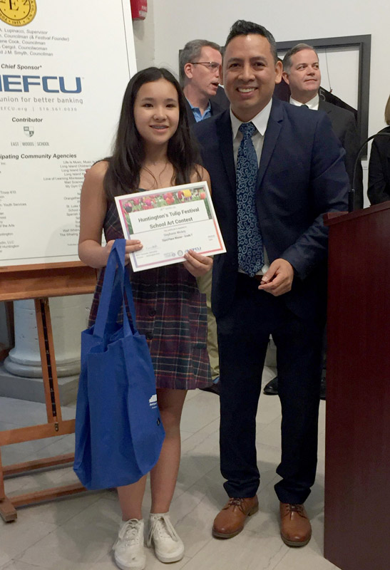 Stephanie Wickey with Franco Ortiz, NEFCU branch manager.