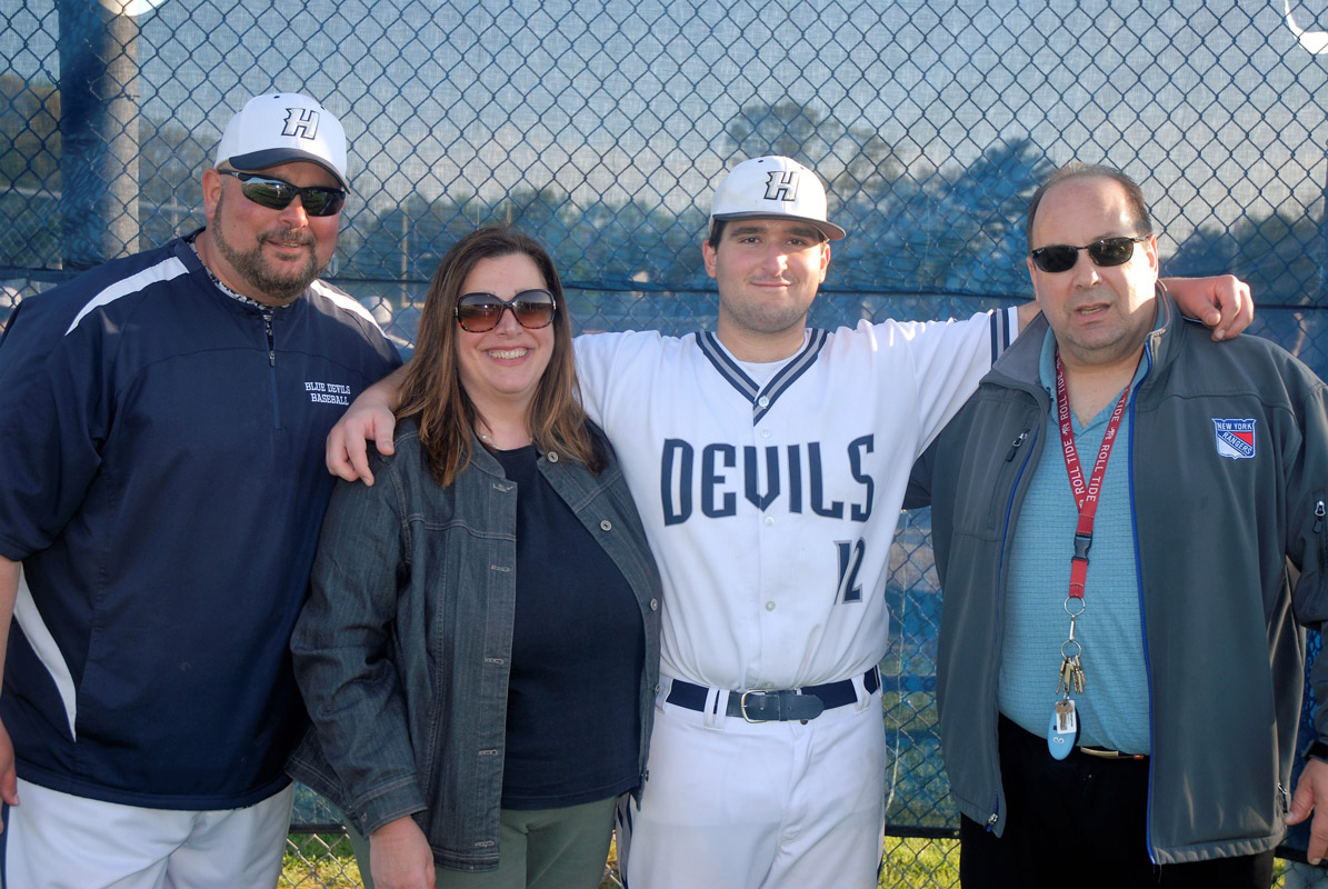 Michael Marziliano with his parents and head coach Billy Harris on Senior Day. (Monica Fredericks photo.)