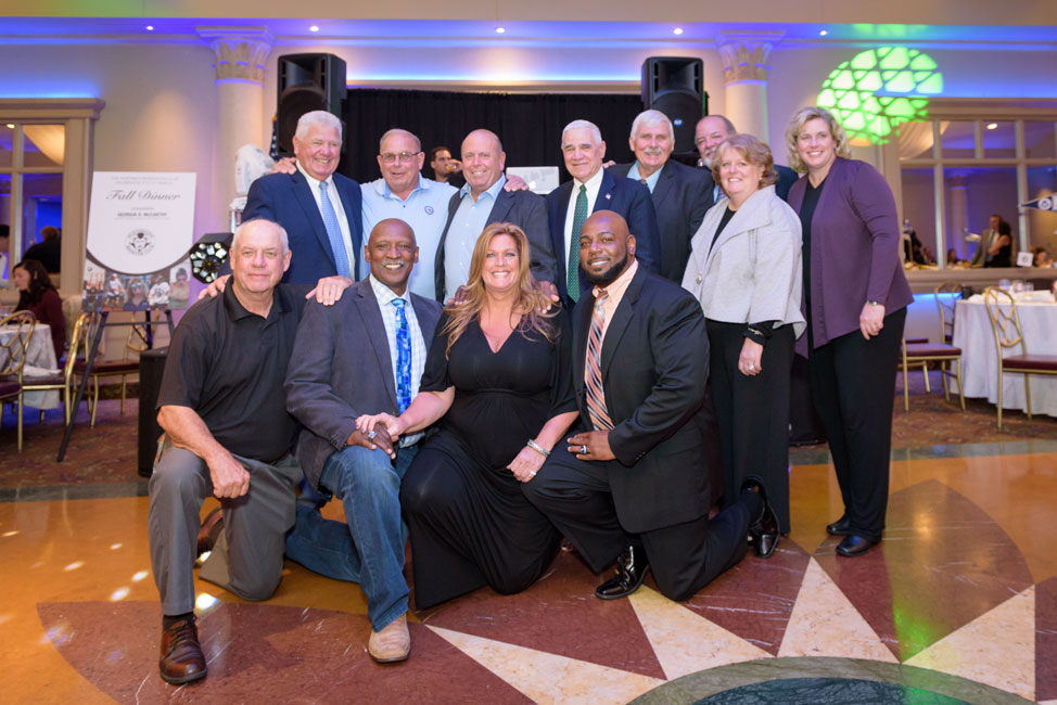 Georgia McCarthy (center front) with past Booster Club honorees. (Darin Reed photo.)