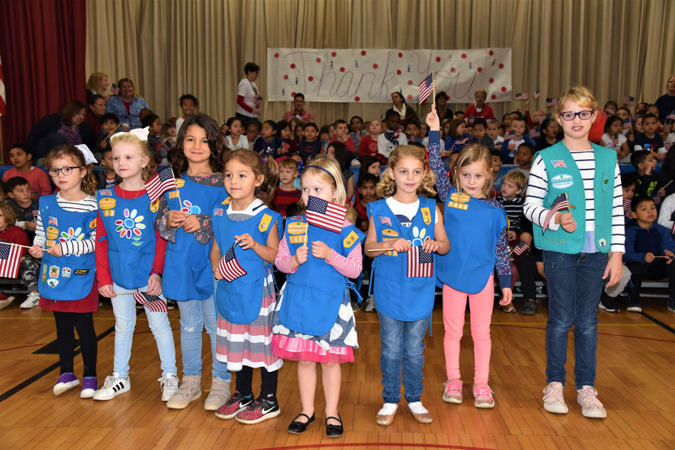A group of students led those gathered in the Pledge of Allegiance