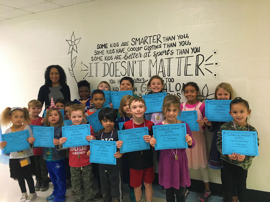 Flower Hill's October Star Student Award honorees with social worker Gisselle Soto.