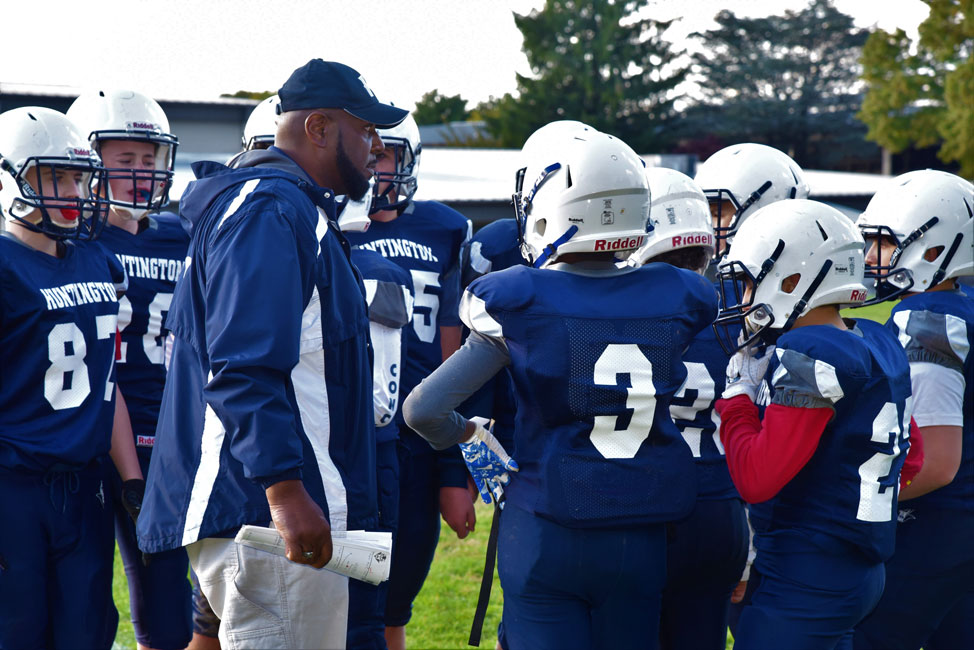 Finley-8 football huddles to review the game plan.