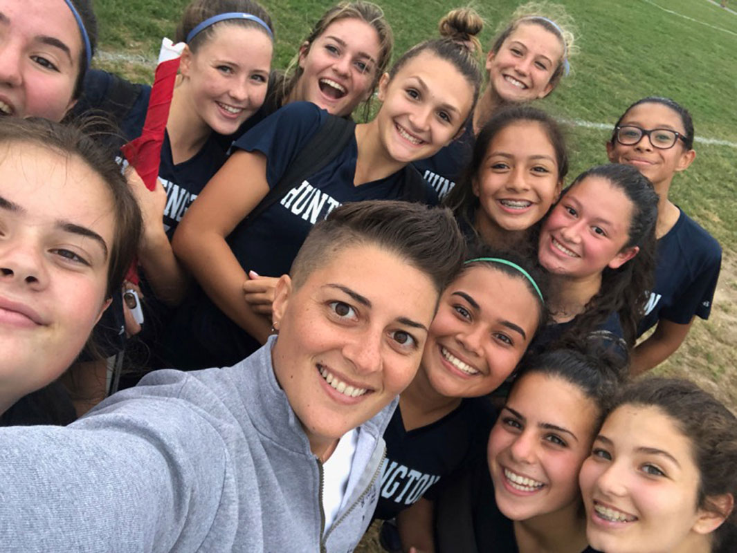 Head coach Maria Canino and Huntington JV girls' soccer team.