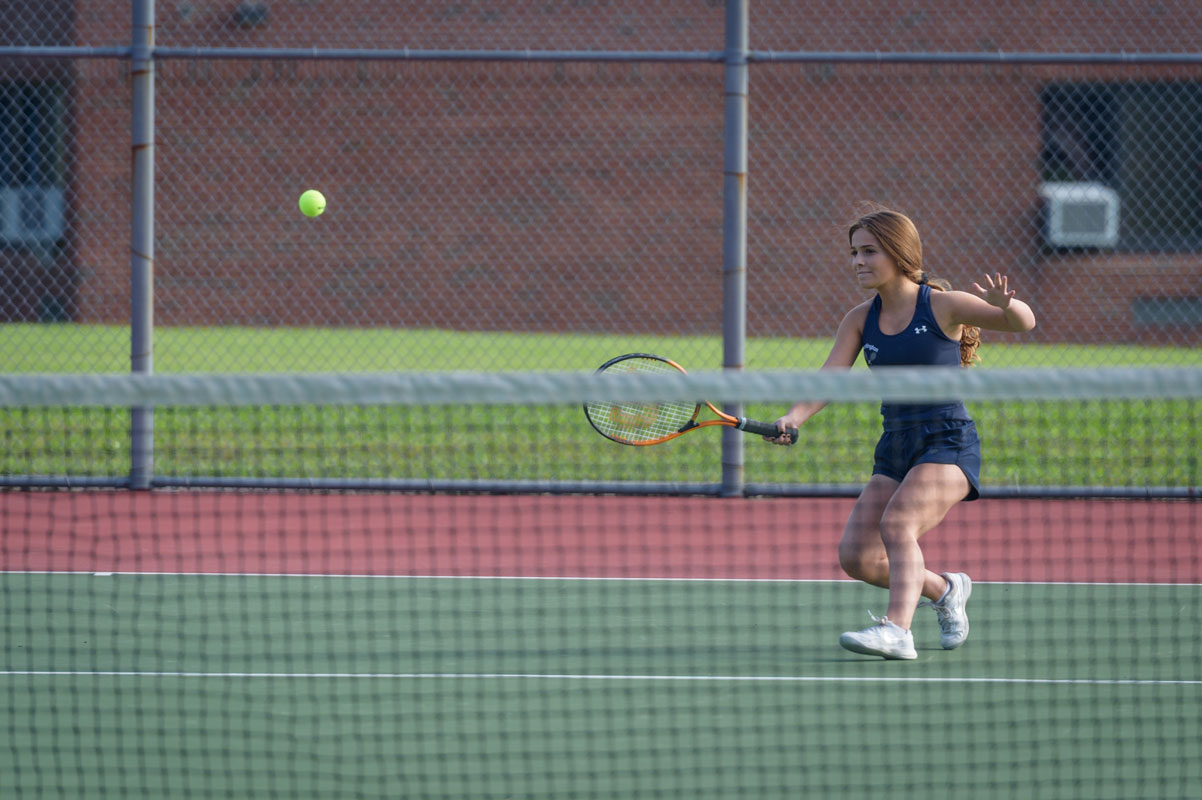 Ashlyn Case returns the ball for Huntington. (Darin Reed photo