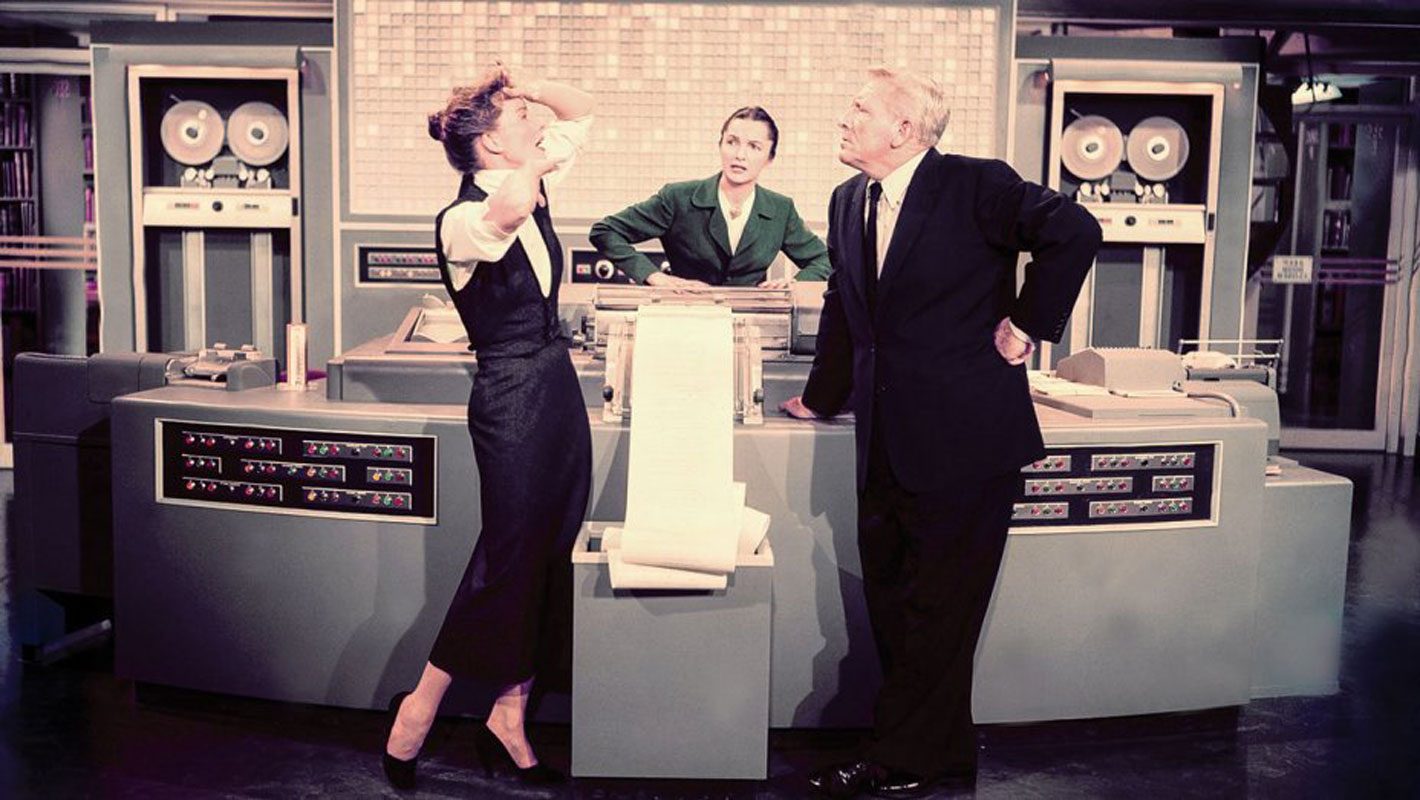 Katharine Hepburn and Spencer Tracy on the set of the movie Desk Set.
