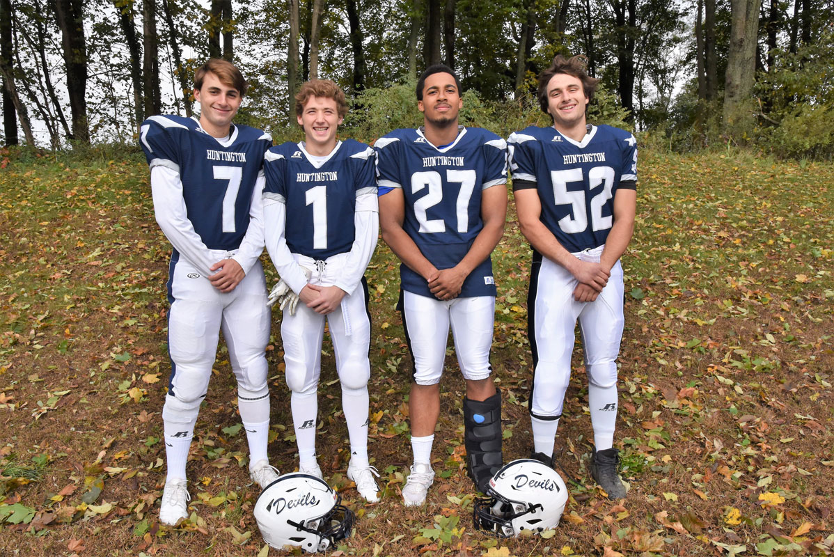 Huntington's 2018 football captains John P. Paci, Pat Durand, Eric Sands and Bryce Criscuola.