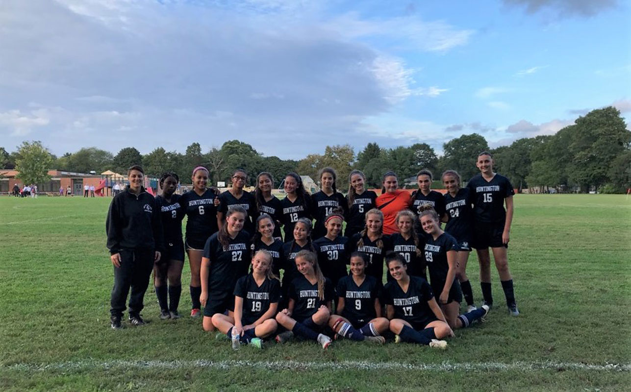 Head coach Maria Canino and the 2018 Huntington JV girls' soccer team.