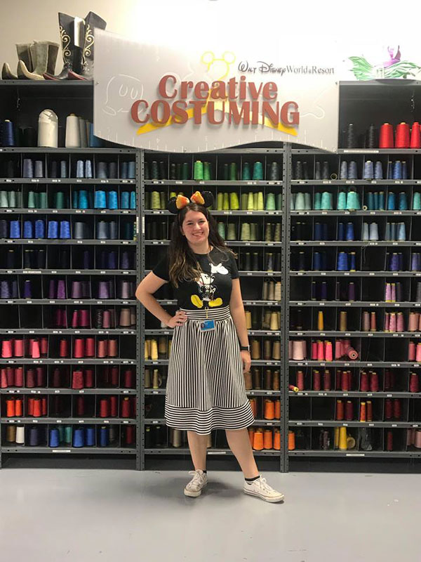 Huntington alum Mary Pulizzotto near the thread spools in the costume department at Walt Disney World.