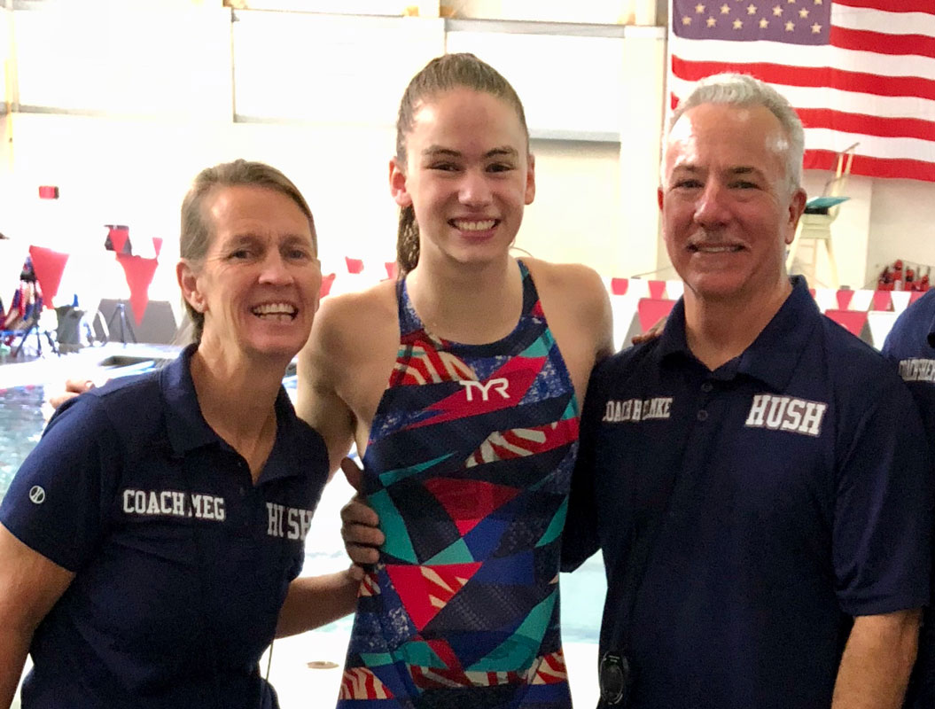 Huntington's Kathryn Montefusco is flanked by coaches Meg McConnell and Chris Helmke.