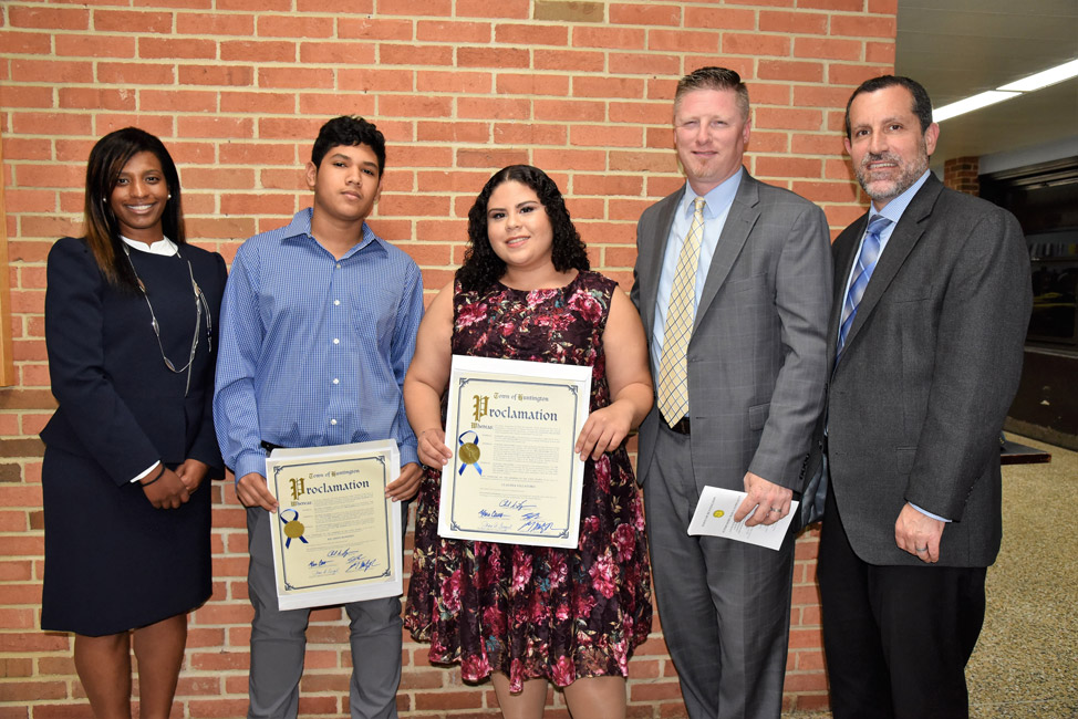 Huntington Supt. Jim Polansky, Principal Brenden Cusack and AP Lisette Lors flank Ricardo Romero and Claudia Villatoro 
