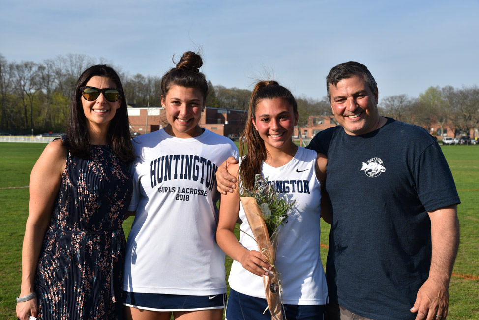 Lena Annunziata (second from left) with her sister, Bella and parents, Tiffany and Anthony on girls' lax 2018 Senior Day.