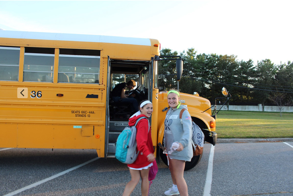 Mia Breitbarth and Maire Brown head off to a Huntington tennis meet.