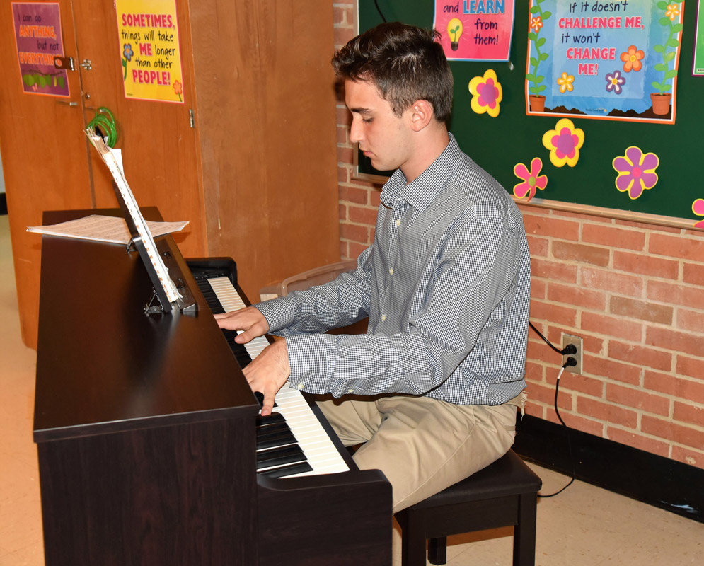 Huntington junior Michael Reed was the guest pianist at the tenure reception on Monday night