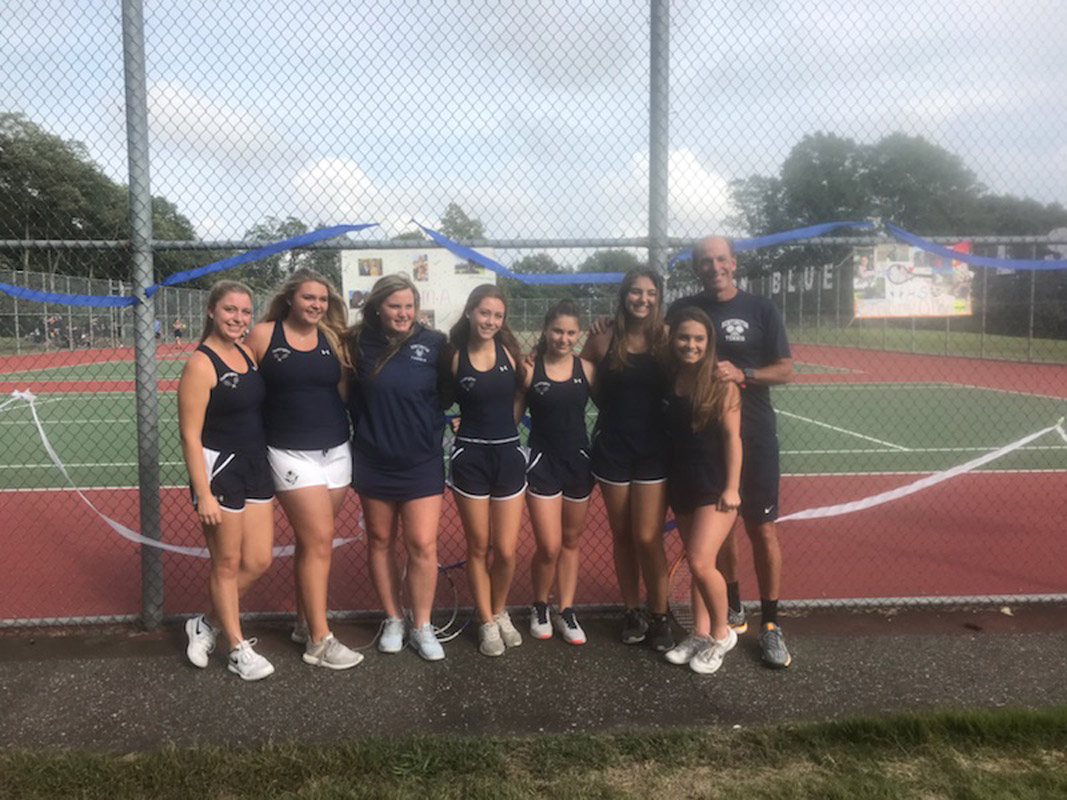 Huntington tennis coach Jamie Fishlow with the team's seven seniors 
