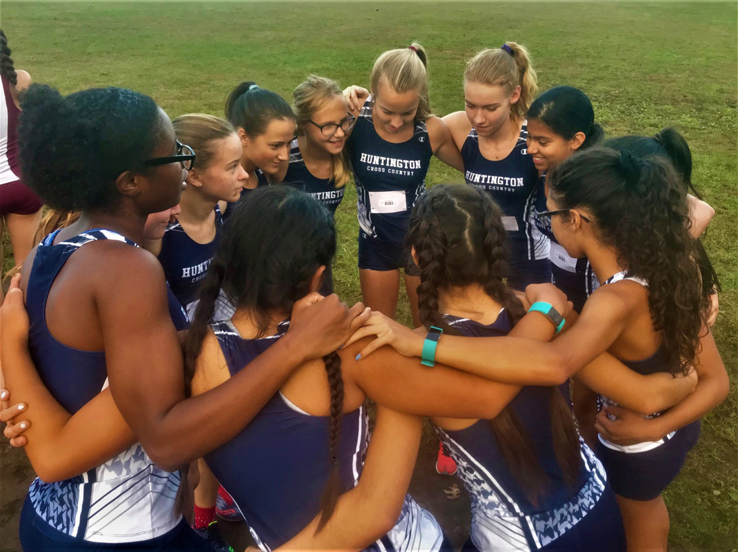 Huntington girls' cross country teammates are very close to one another.