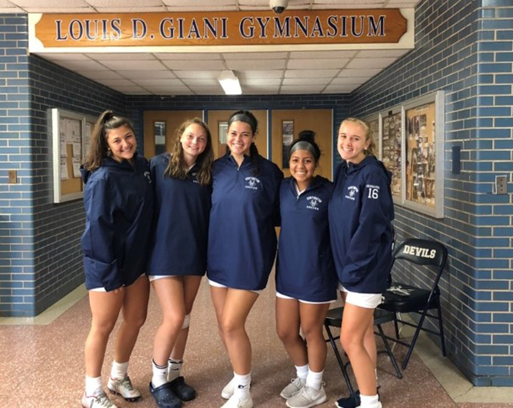 Riva Bergman (center) with some of her soccer teammates.