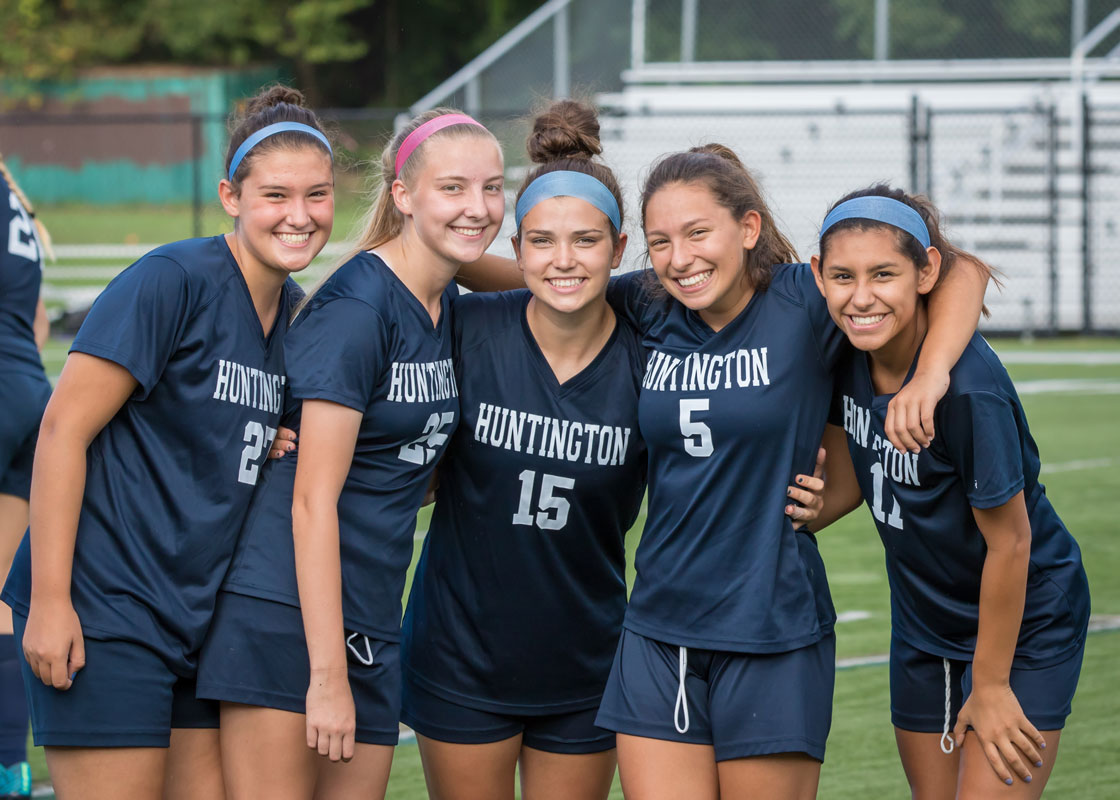 Kiara Rafailan (right) with her soccer teammates last fall. (Mike Connell photo.)
