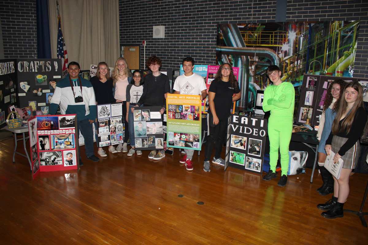 Art students were more than happy to stand alongside the colorful display.