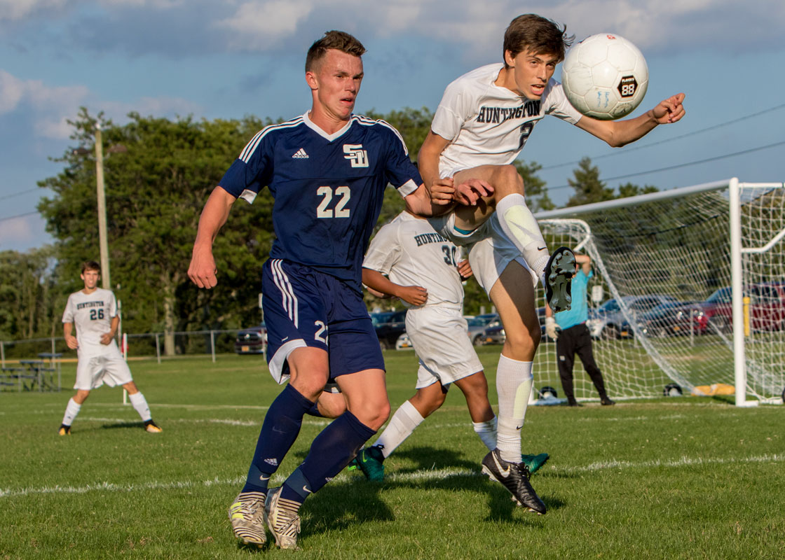 Christian Bellissimo (right) battles for the ball during his junior year. (Mike Connell photo.)
