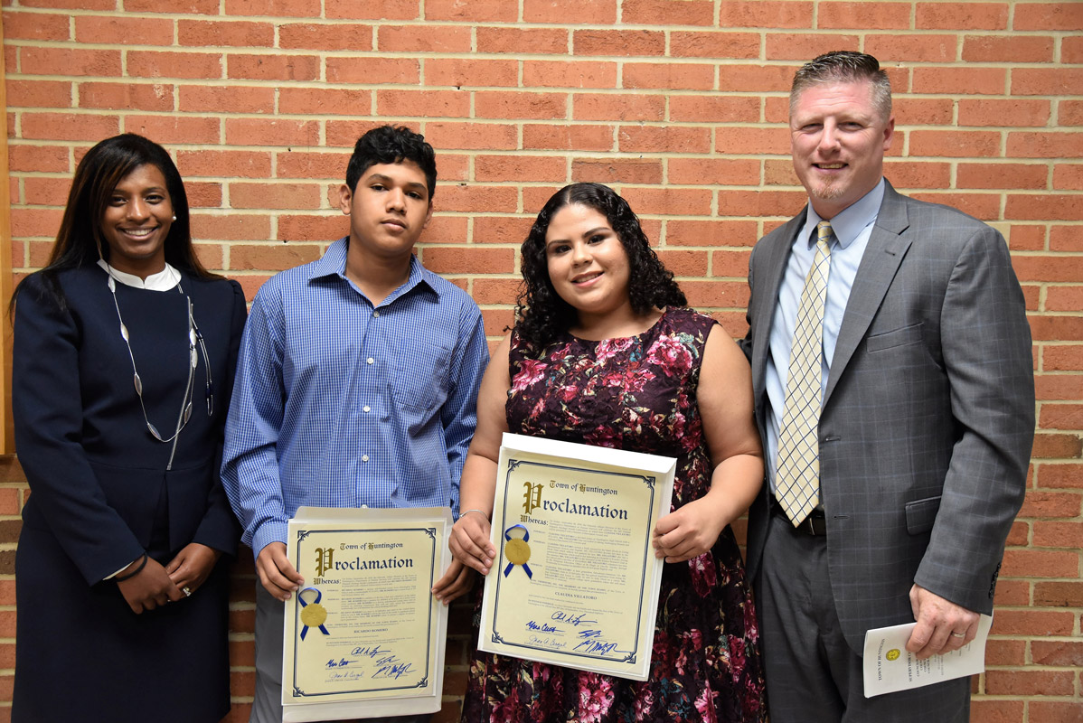 Huntington Principal Brenden Cusack and Asst. Principal Lisette Lors flank Ricardo Romero and Claudia Villatoro 