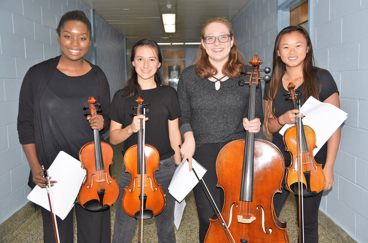 Arielle Harvey, Ella Siepel, Hannah Bailan and Haley Mortell performed at the Huntington School Board meeting 
