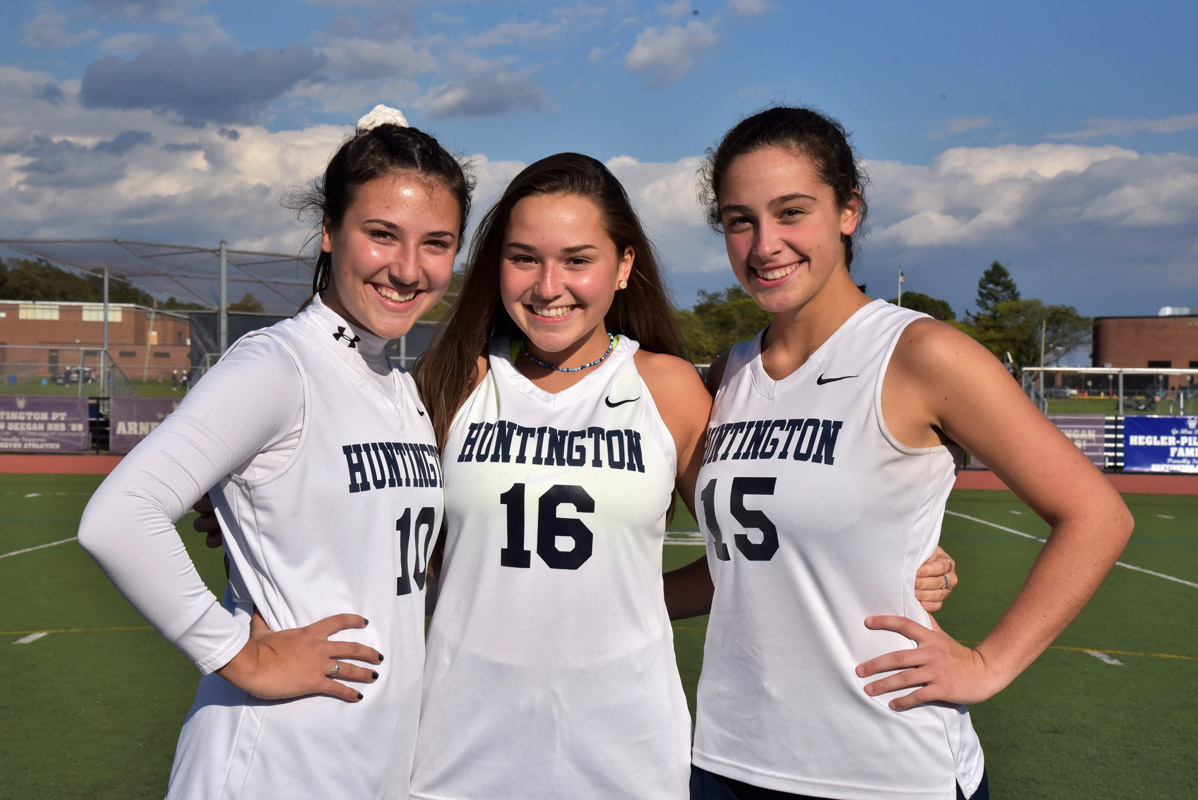 Huntington field hockey captains Phoebe Walther, Brooke Goldsmith and Morgan Minicozzi.
